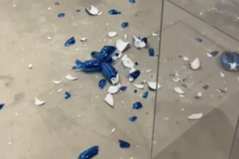 Jeff Koons sculpture Balloon Dog (Blue) shattered in Miami.