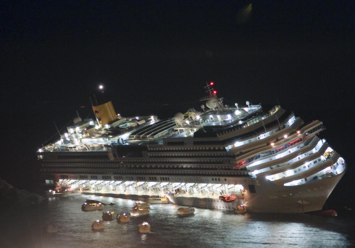 The luxury cruise ship Costa Concordia lays on its starboard side after it ran aground off the coast of Italy in 2012.