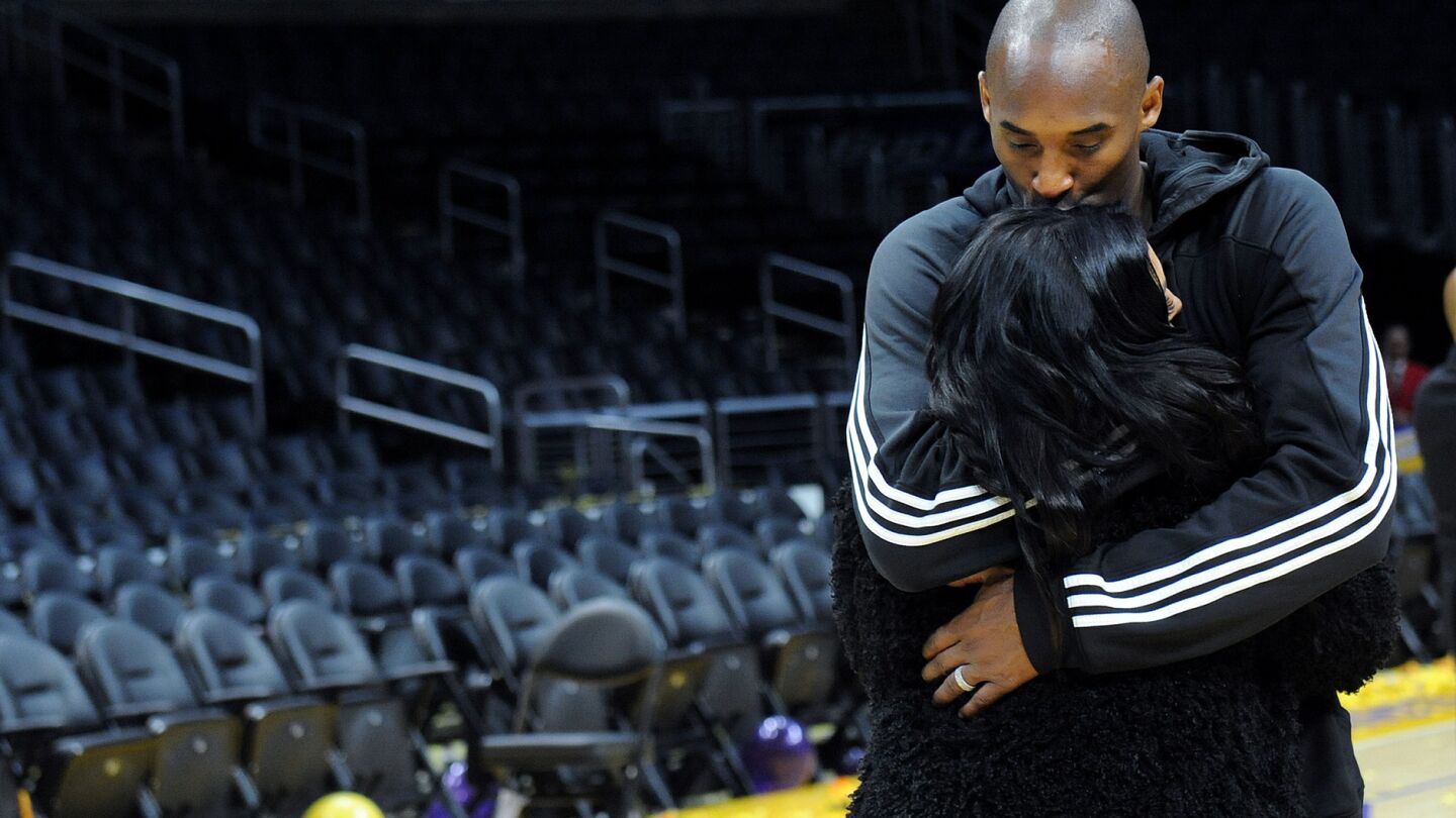 Kobe Bryant kisses his wife Vanessa after his last game at Staples Center on April 13, 2016.