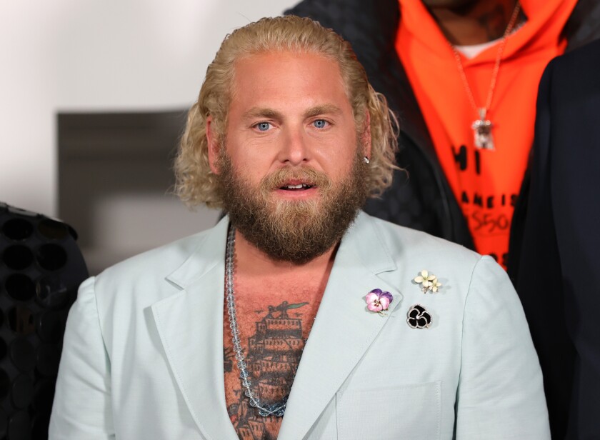 A medium shot of a man in a suit.