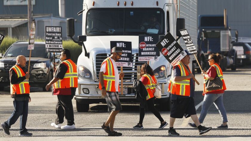 Truck drivers and warehouse workers protest their classification as independent contractors by Los Angeles and Long Beach port trucking companies in October.