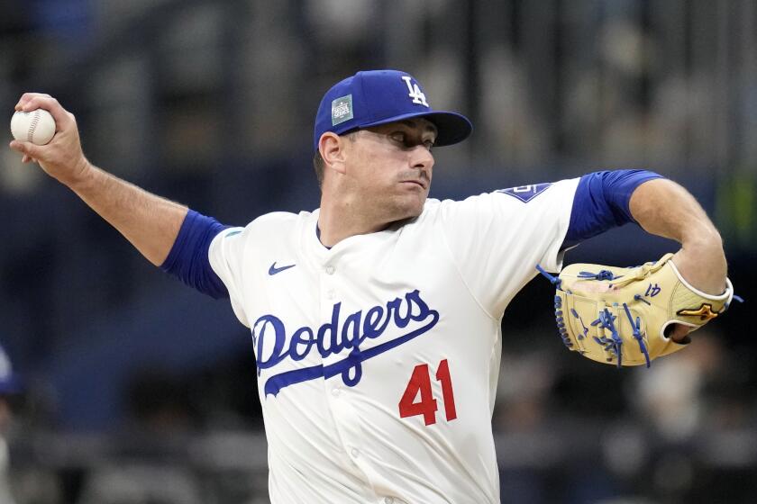 Los Angeles Dodgers' Daniel Hudson pitches during the exhibition game between.