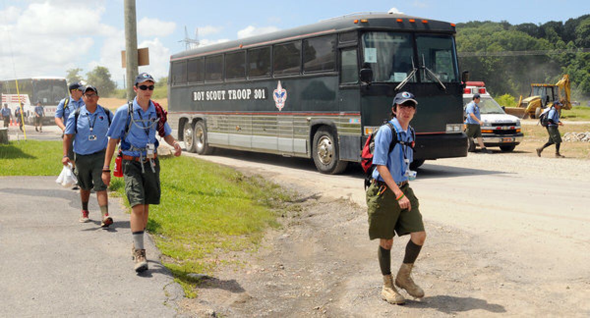 Staff members arrive at the Summit Bechtel Family National Scout Reserve near Glen Jean, W.Va., for the Boy Scouts of America's national Jamboree on Monday. This year's event is the first to involve fitness requirements for participants.