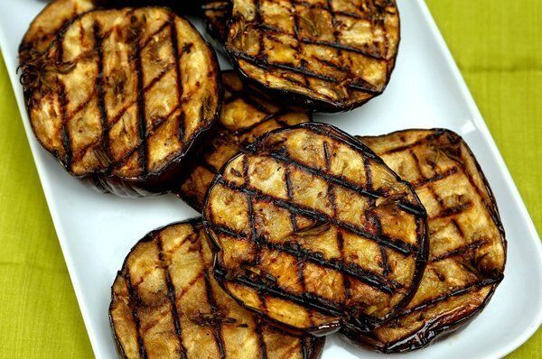 Thick eggplant slices are flavored with anchovies, garlic and rosemary. Recipe: Grilled eggplant with anchovies, garlic and rosemary