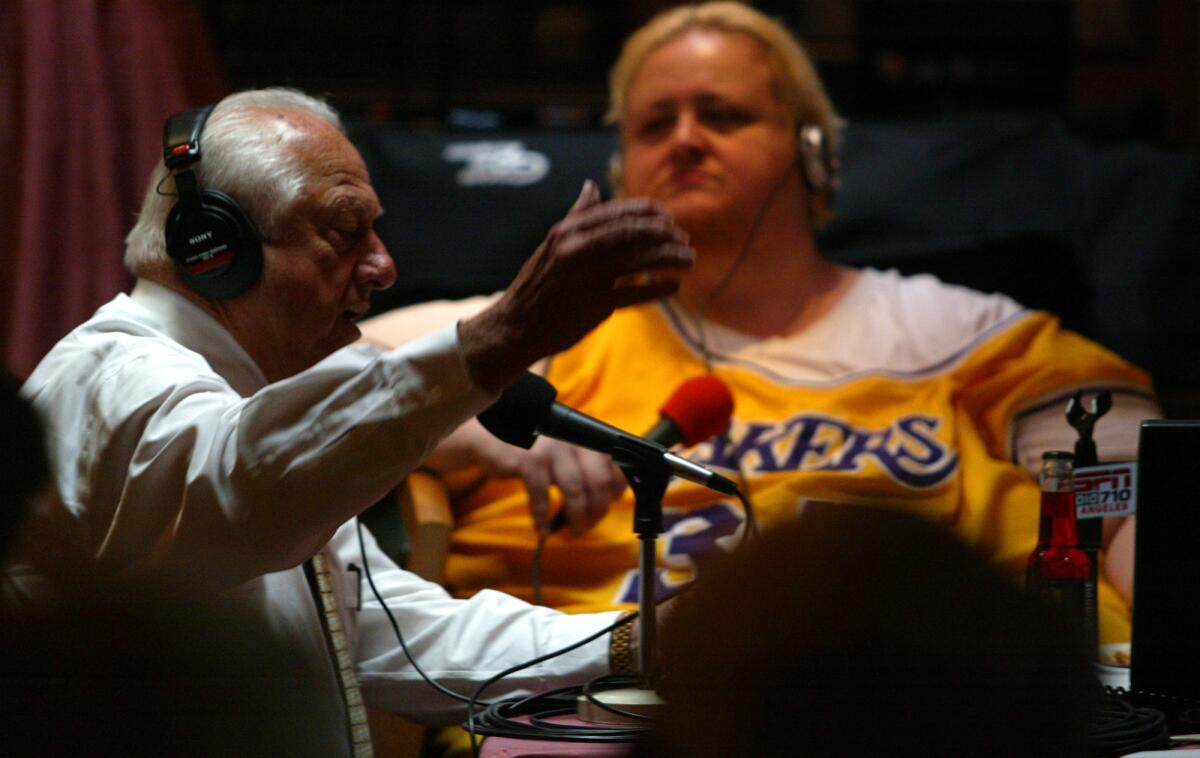 Joe McDonnell interviews former Dodgers manager Tommy Lasorda during a live show at Phil Trani's restaurant in Long Beach on Dec. 1, 2003.