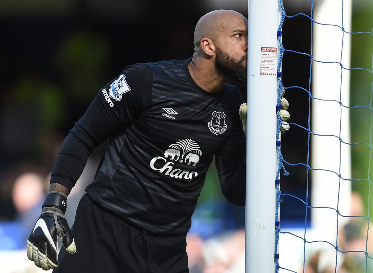 U.S. goalkeeper Tim Howard kisses the goal post at the whistle of his final Premier League match with Everton on May 15.