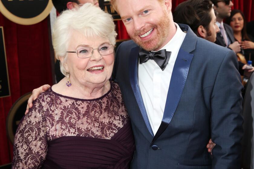 "Nebraska" actress June Squibb, left, poses with Jesse Tyler Ferguson of "Modern Family" at the 20th Screen Actors Guild Awards.