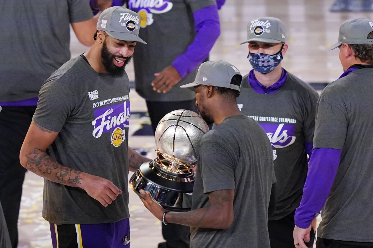 Anthony Davis, left, and his Lakers teammates check out the Western Conference championship on Sept. 26, 2020.