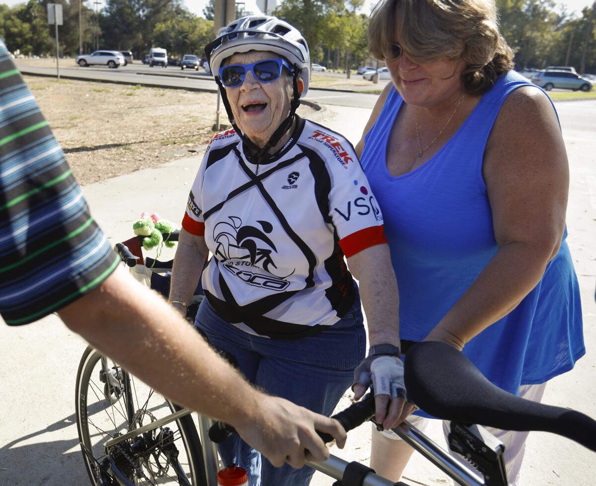 June Clark, 86, left, a resident of Cypress Court, a senior living community in Escondido, is all smiles after her first bicycle ride ever, as her friend, Juli Everett, right, stood with her after the ride at Kit Carson Park, September 19, 2019, in Escondido, California.