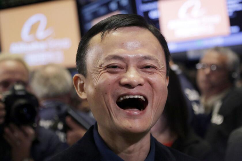 FILE - In this Sept. 19, 2014, file photo, Jack Ma, founder of Alibaba, smiles during the company's IPO at the New York Stock Exchange in New York. Remarks by Ma, one of China's richest men, that young people should work 12-hour days, six days a week if they want financial success have prompted a public debate over work-life balance in the country. (AP Photo/Mark Lennihan, File)