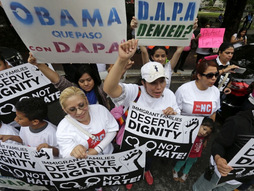 Demonstrators, led by the New Orleans Worker Center for Racial Justice and the Congress of Day Laborers, participate in a rally outside the U.S. 5th Circuit Court of Appeals in New Orleans, where judges are considering the constitutionality of President Obama's executive actions on immigration.