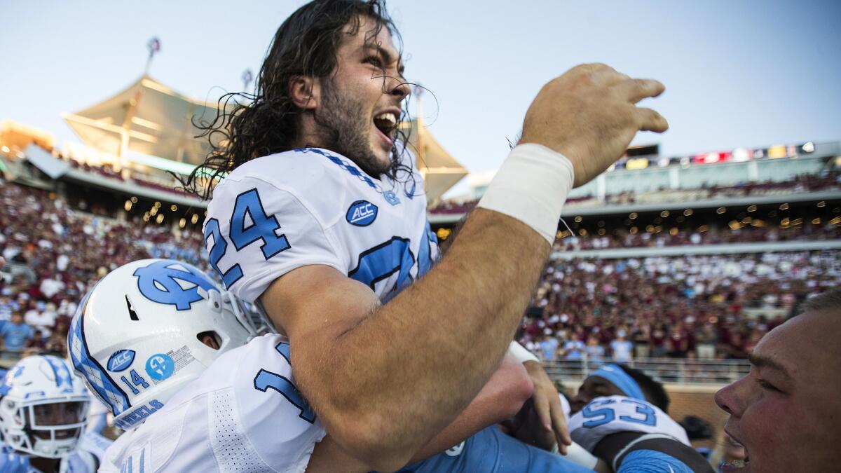 North Carolina players hoist kicker Nick Weiler onto their shoulders after he kicked a game-winning 54-yard field goal against Florida State as time expired Saturday.