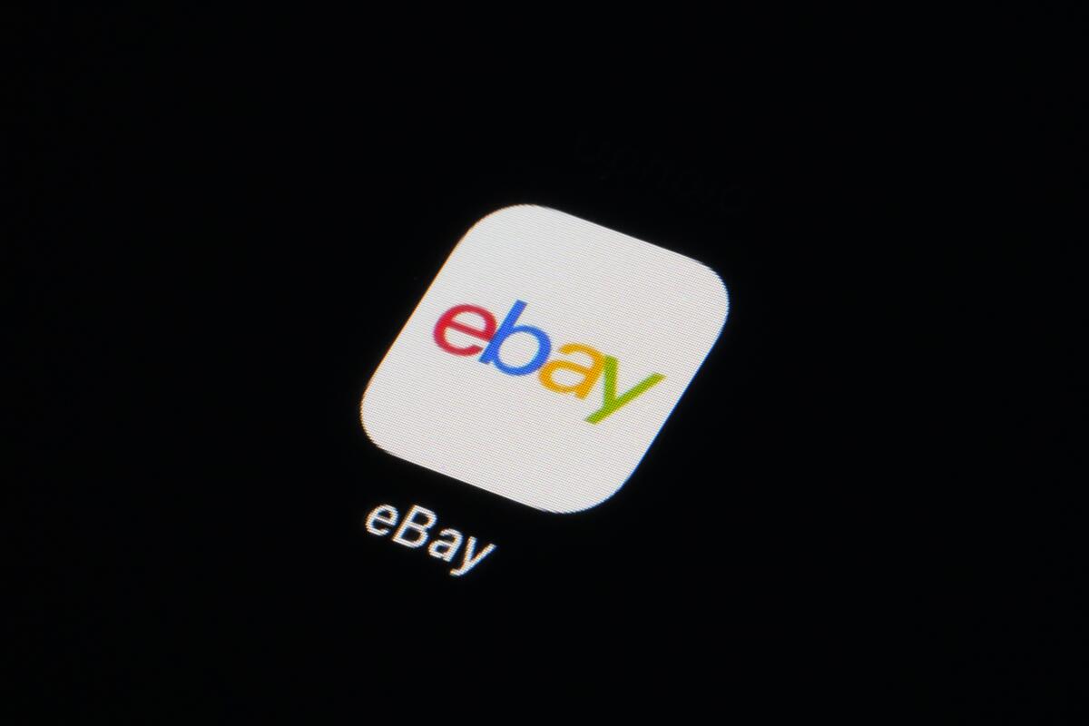 The eBay app icon is seen on a smartphone