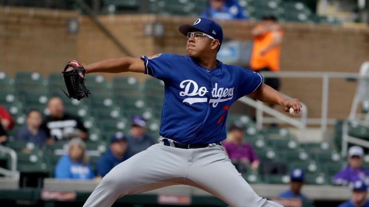 Dodgers left-hander Julio Urias pitches against the Colorado Rockies during a spring training game on Feb. 28.