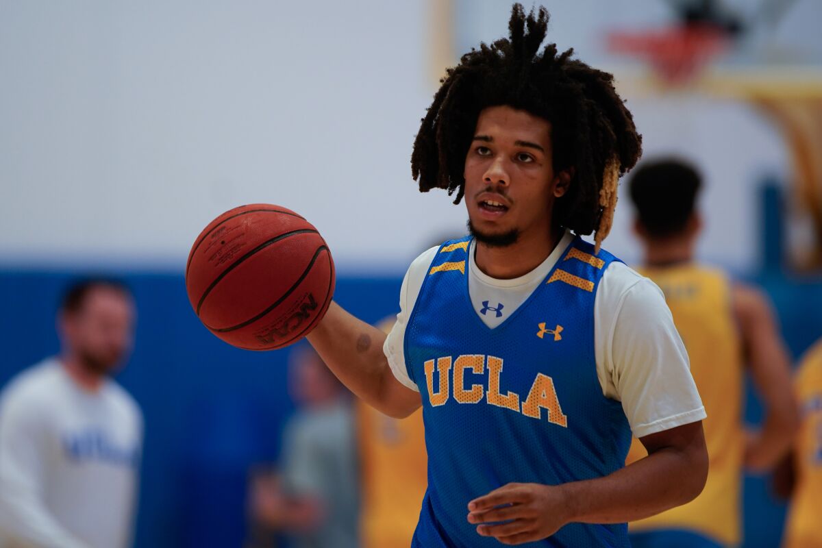 UCLA's Tyger Campbell dribbles during practice at the Mo Ostin Basketball Center on Thursday in Westwood.