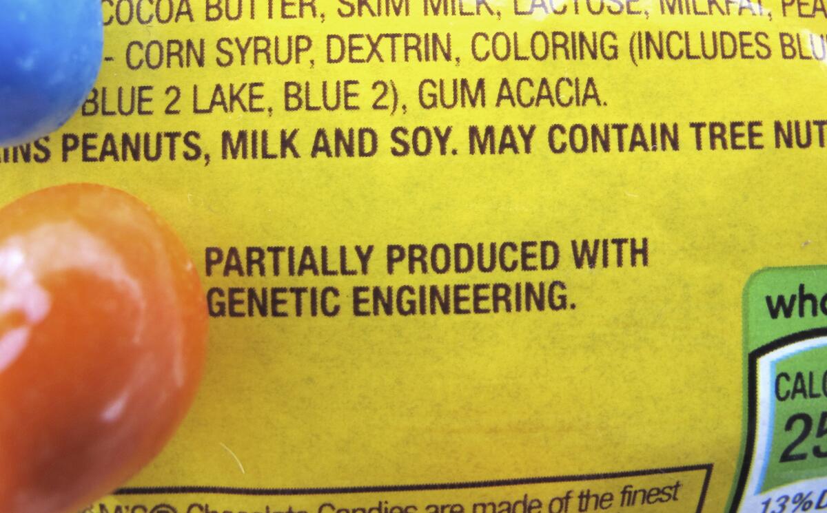 A new disclosure statement on a package of Peanut M&M's candy in Montpelier, Vt. identifies them as being "partially produced with genetic engineering."