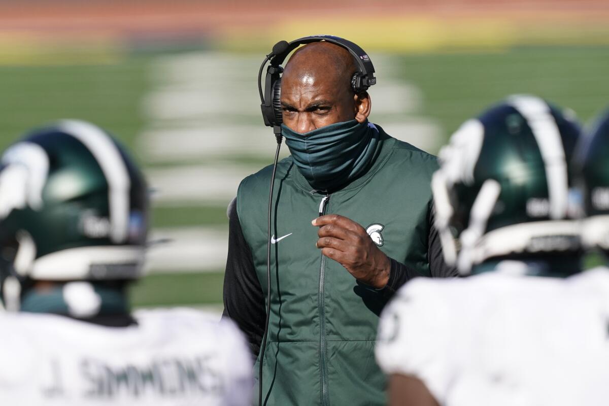 Michigan State coach Mel Tucker talks to his players Oct. 31, 2020, in Ann Arbor, Mich.
