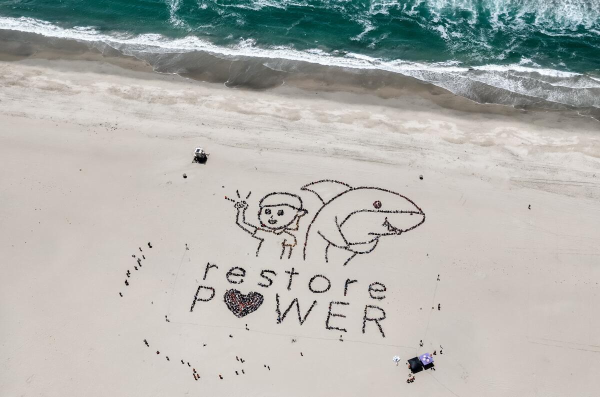 A drone captured the "Restore Power" message created by Orange County elementary students on Tuesday.