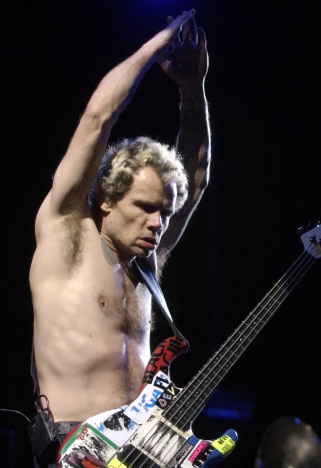 Flea of the Red Hot Chili Peppers performs Sunday night at the Coachella Valley Music and Arts Festival, 2003.
