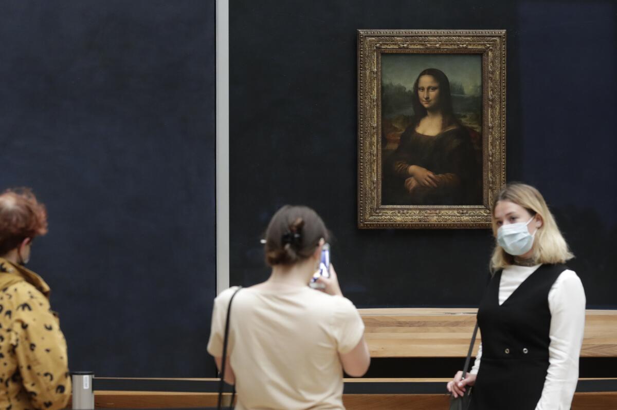 Visitors around Leonardo da Vinci's 'Mona Lisa'