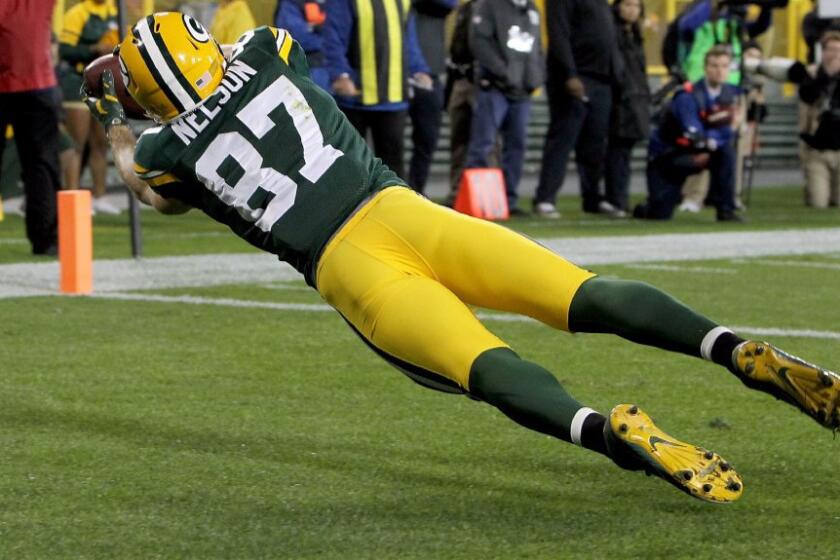 Packers receiver Jordy Nelson dives to make a touchdown catch against the Giants during a game on Oct. 9.