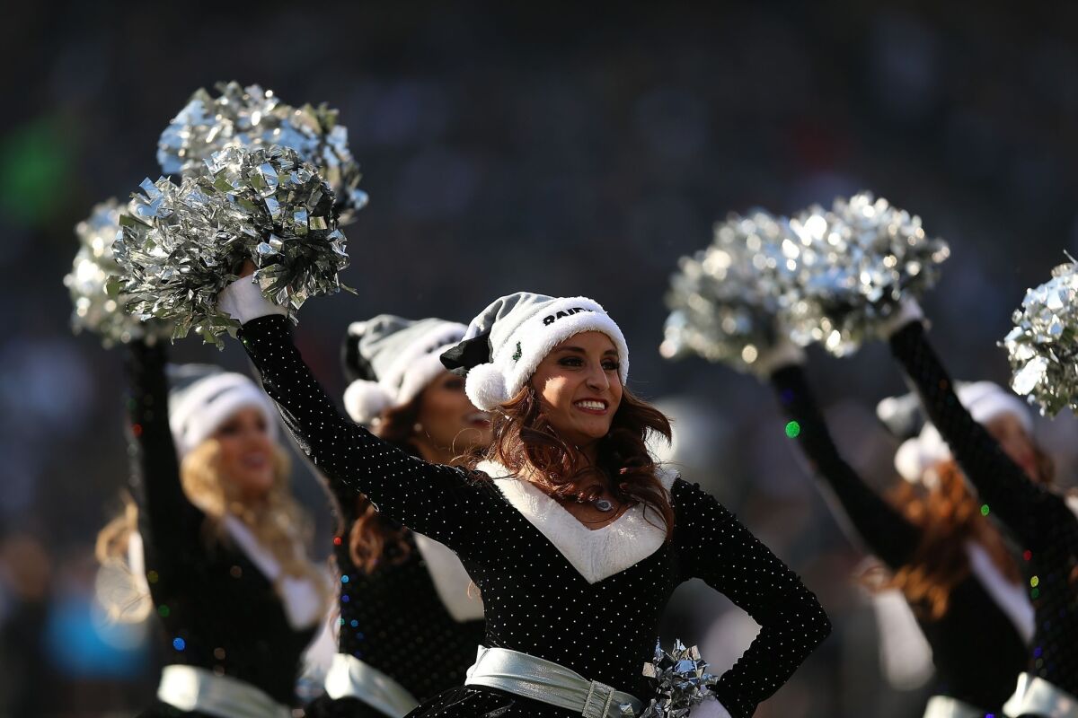 A second Raiderette cheerleader has joined the lawsuit against the team alleging wage theft. Here, Raiderettes perform against the Kansas City Chiefs in Oakland on Dec. 15, 2013.