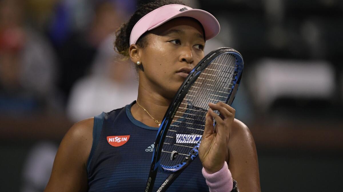 Naomi Osaka reacts after losing to Belinda Bencic at the BNP Paribas Open on Tuesday in Indian Wells.
