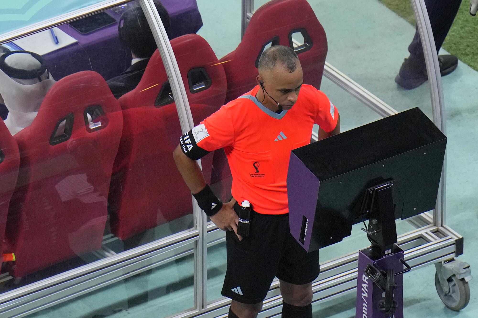 Referee Wilton Pereira Sampaio pauses the match and asks for the VAR.