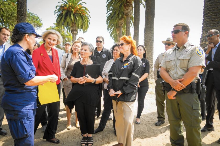 Rep. Lois Capps, second from left, and Sen. Barbara Boxer visit Refugio State Beach on Aug. 25, 2015, after an oil spill.