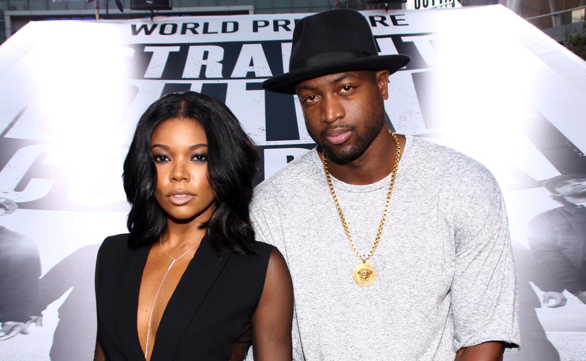 Gabrielle Union, left, and Dwyane Wade arrive at the Los Angeles premiere of "Straight Outta Compton" 