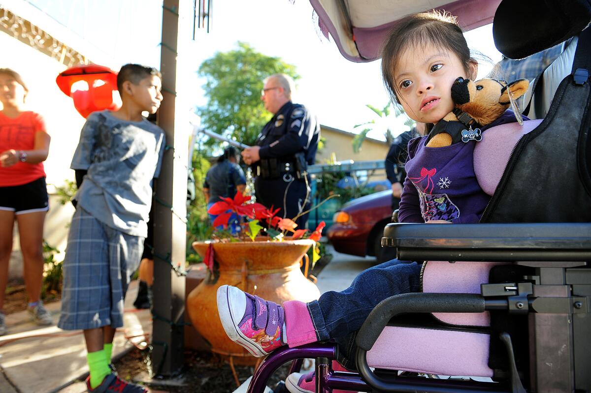 Jocelyn Ordonez, 4, tries out her new wheelchair.