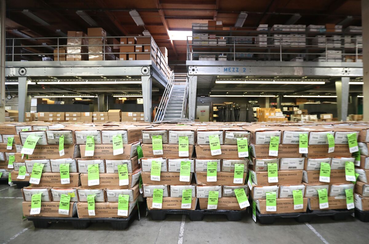 Pallets bearing voter ballots at the Orange County Registrar of Voters facility in Santa Ana on Wednesday.