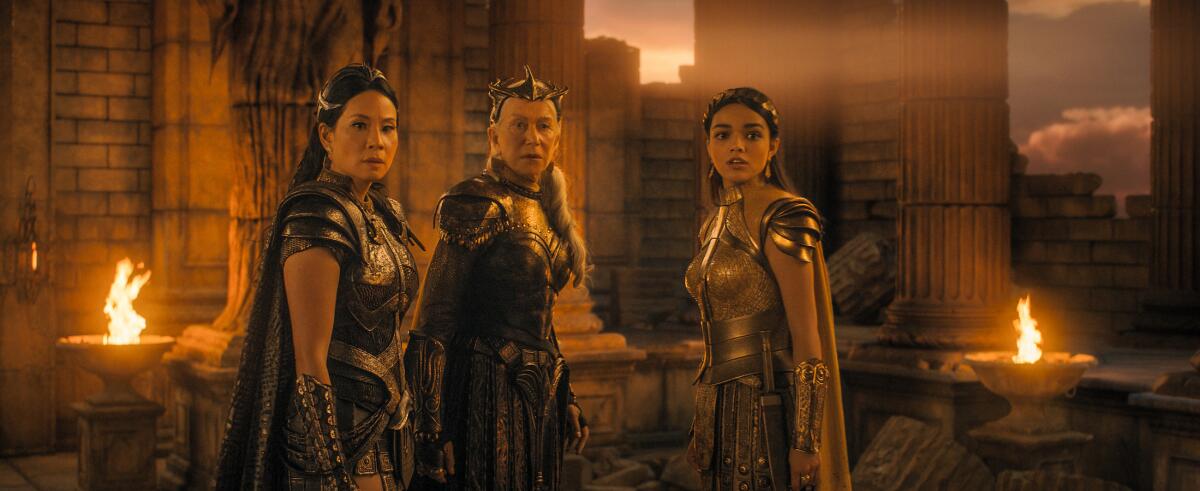 Three actresses in costume in the movie "Shazam! Fury of the Gods."