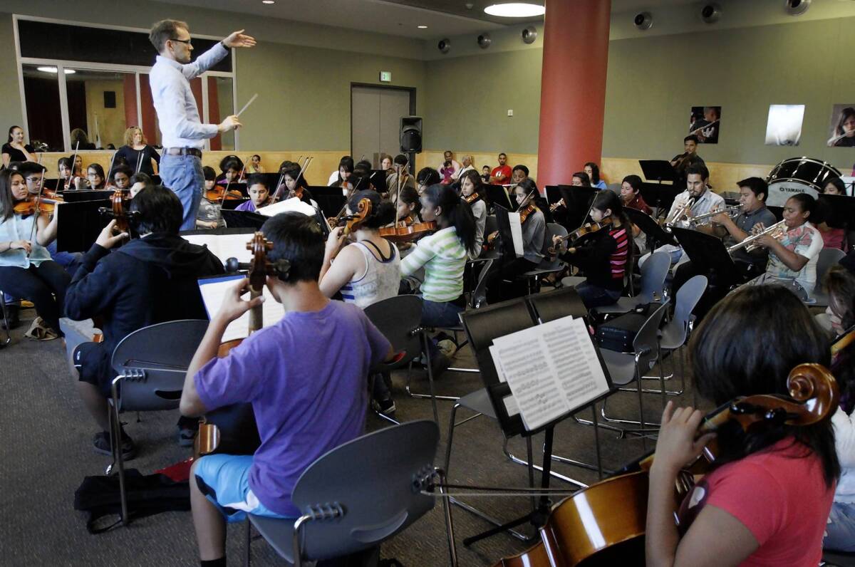 Bruce Kiesling conducts Youth Orchestra Los Angeles at the Expo center in Exposition Park in Los Angeles on Sept. 18, 2013.