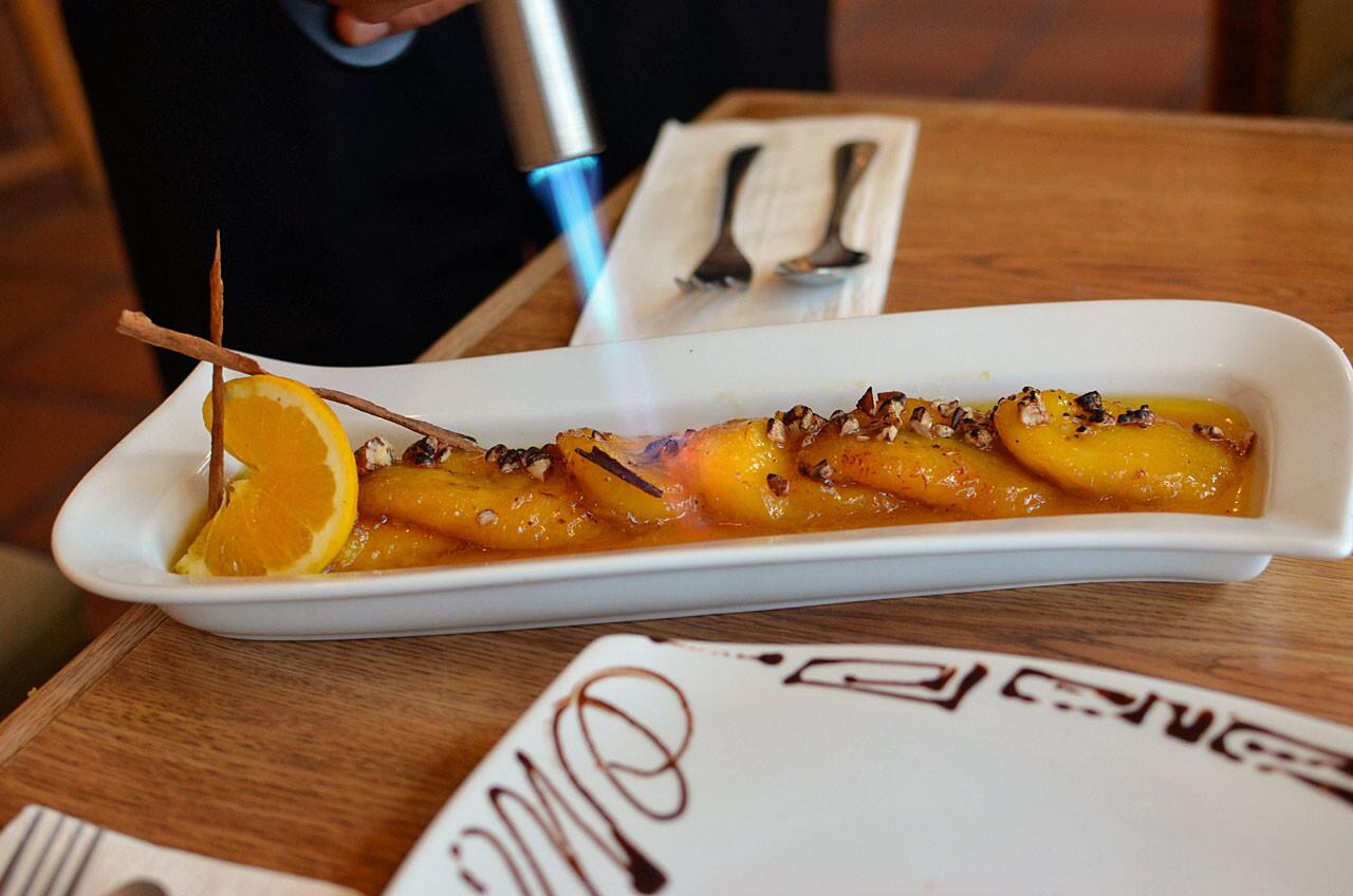 Platanos al Mezcal: Custardy-ripe plantains are torched and served in a smoky mezcal sauce.