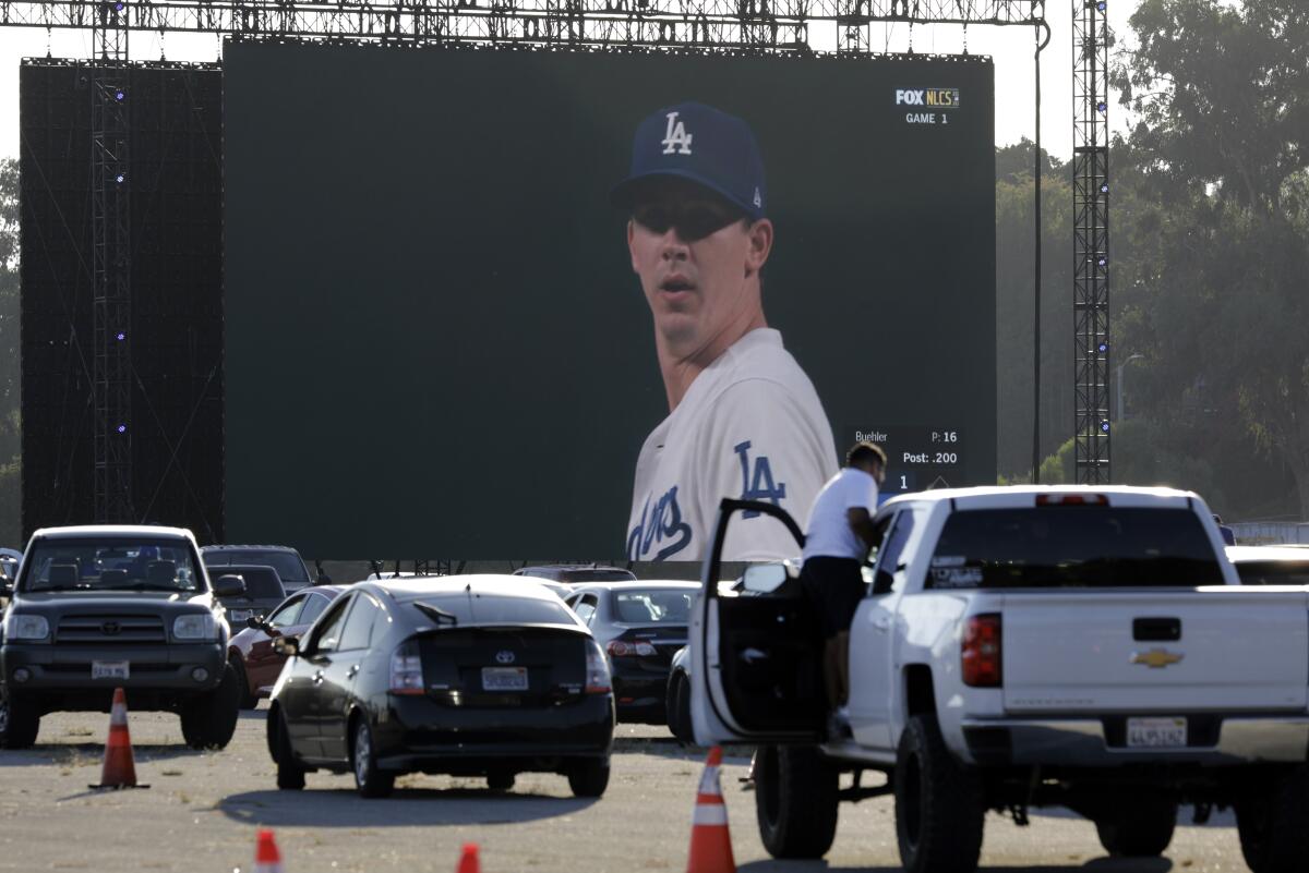 Fans drive into Dodger Stadium to watch the National League Championship Series.