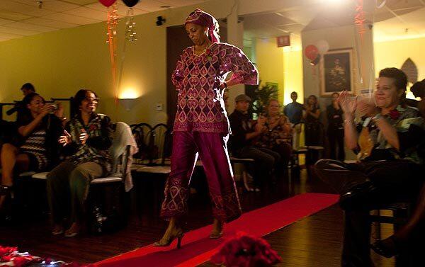 Army veteran Leslie Gober,52, of Long Beach models African fashion during the Women's Veterans Fashion Show at a Los Alamitos restaurant. GI Hope and Amvets sponsored the event. See full story