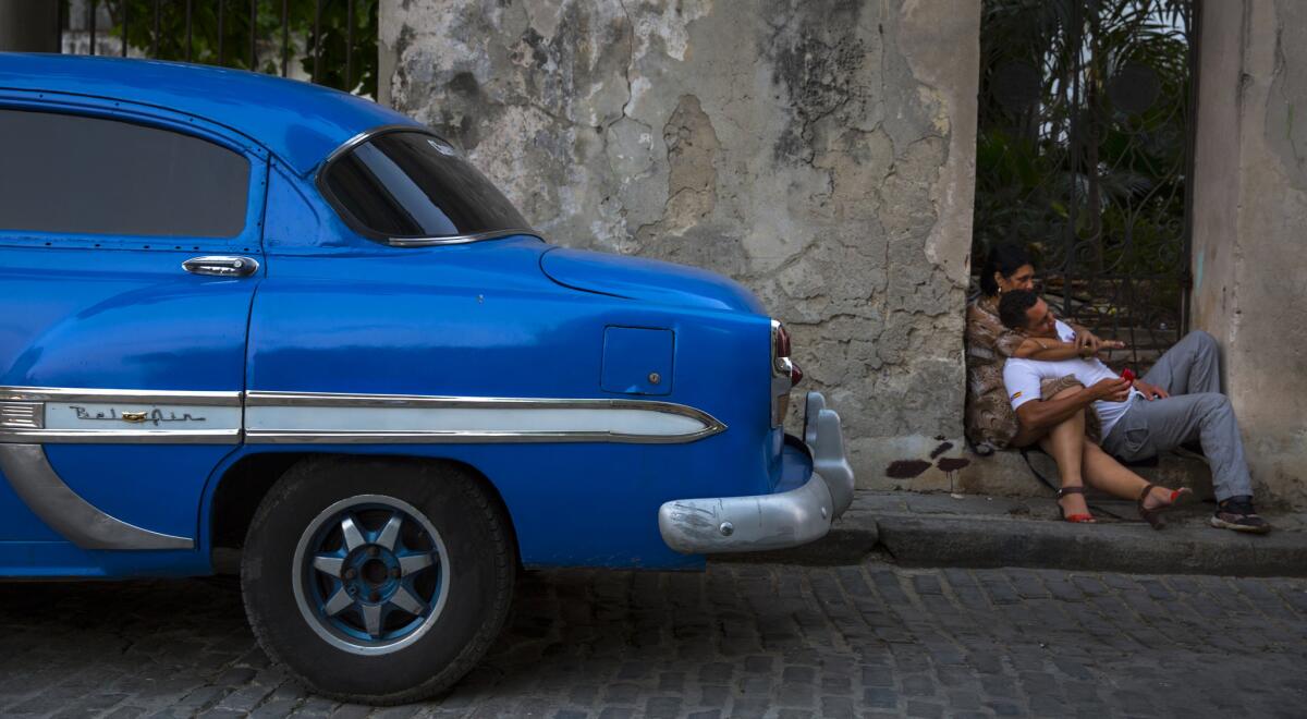A couple find a quiet spot to relax on a balmy evening in Habana Vieja in Havana.