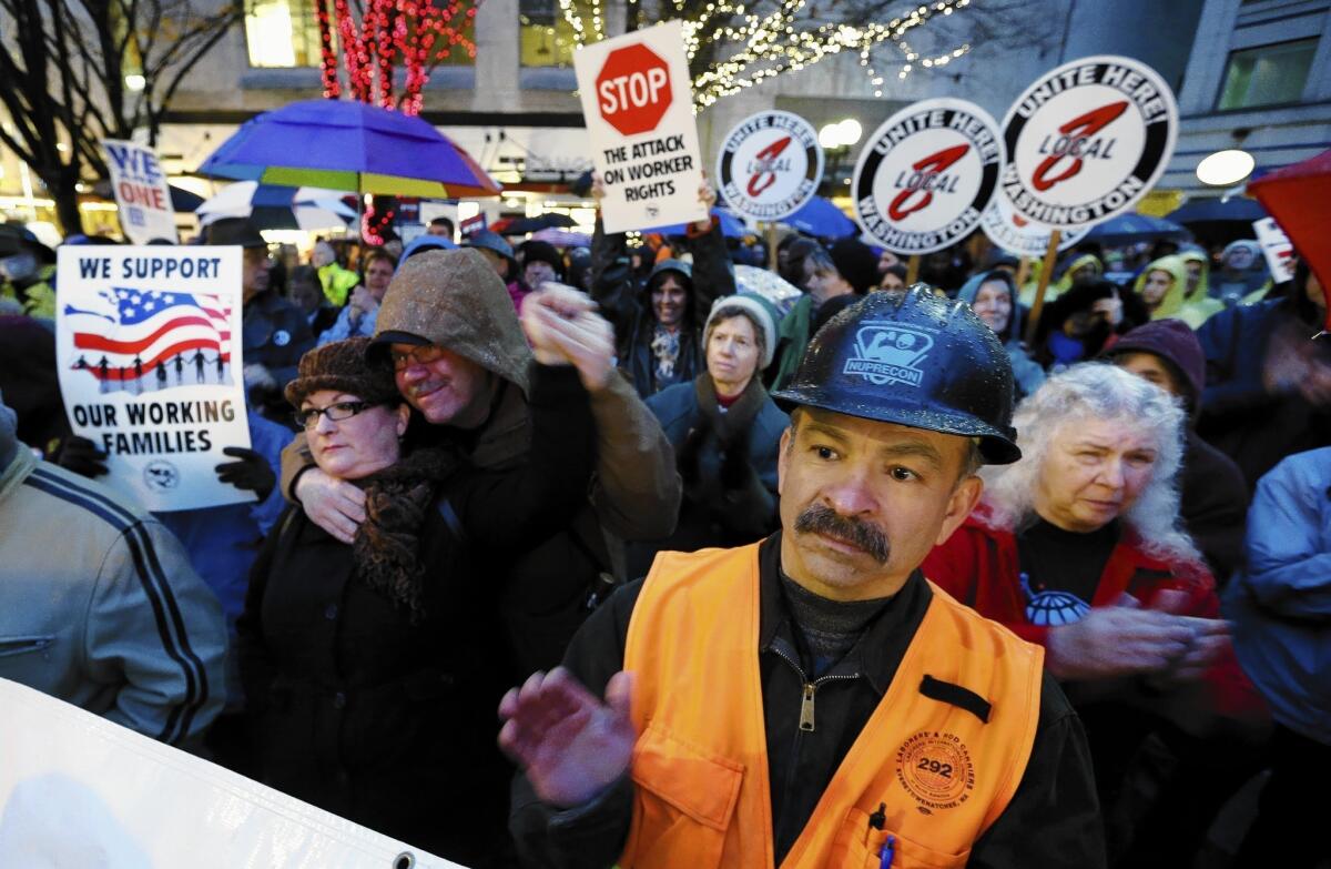 Union workers and supporters hold a rally last month in Seattle calling for Boeing to build its 777X airliner in Washington. The aerospace giant is considering other locations.