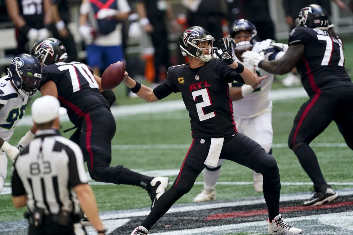 Atlanta Falcons quarterback Matt Ryan (2) works in the pocket against the Seattle Seahawks during the second half of an NFL football game, Sunday, Sept. 13, 2020, in Atlanta. (AP Photo/John Bazemore)