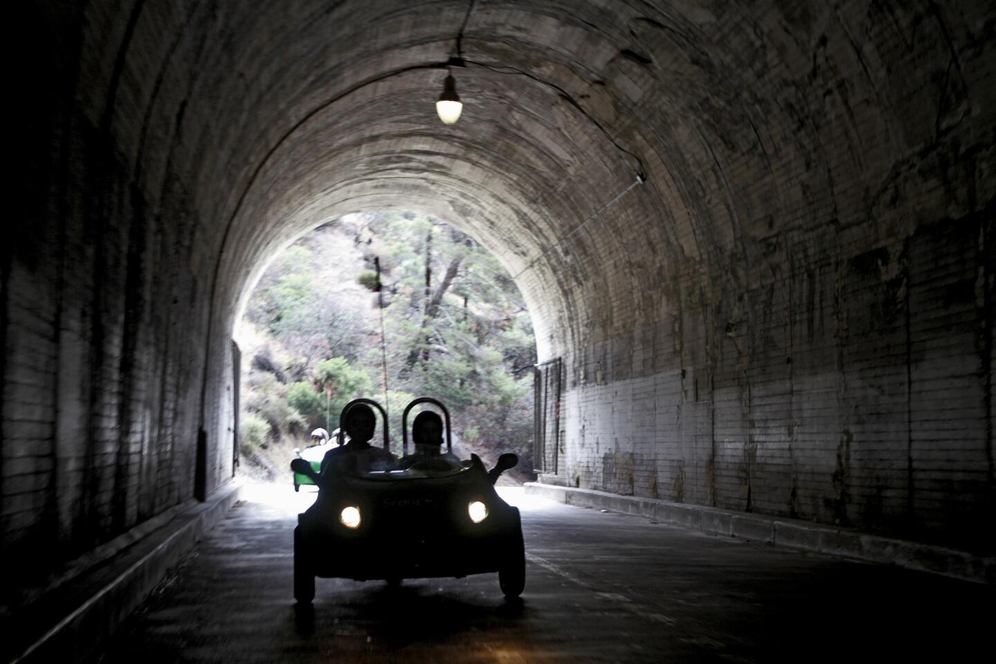 Sunnyday Scoot guests drive through the Griffith Park tunnel on a three-wheel scooter during a three-hour, Red Carpet tour, offered by the Burbank-based company on Friday, June 5, 2015.