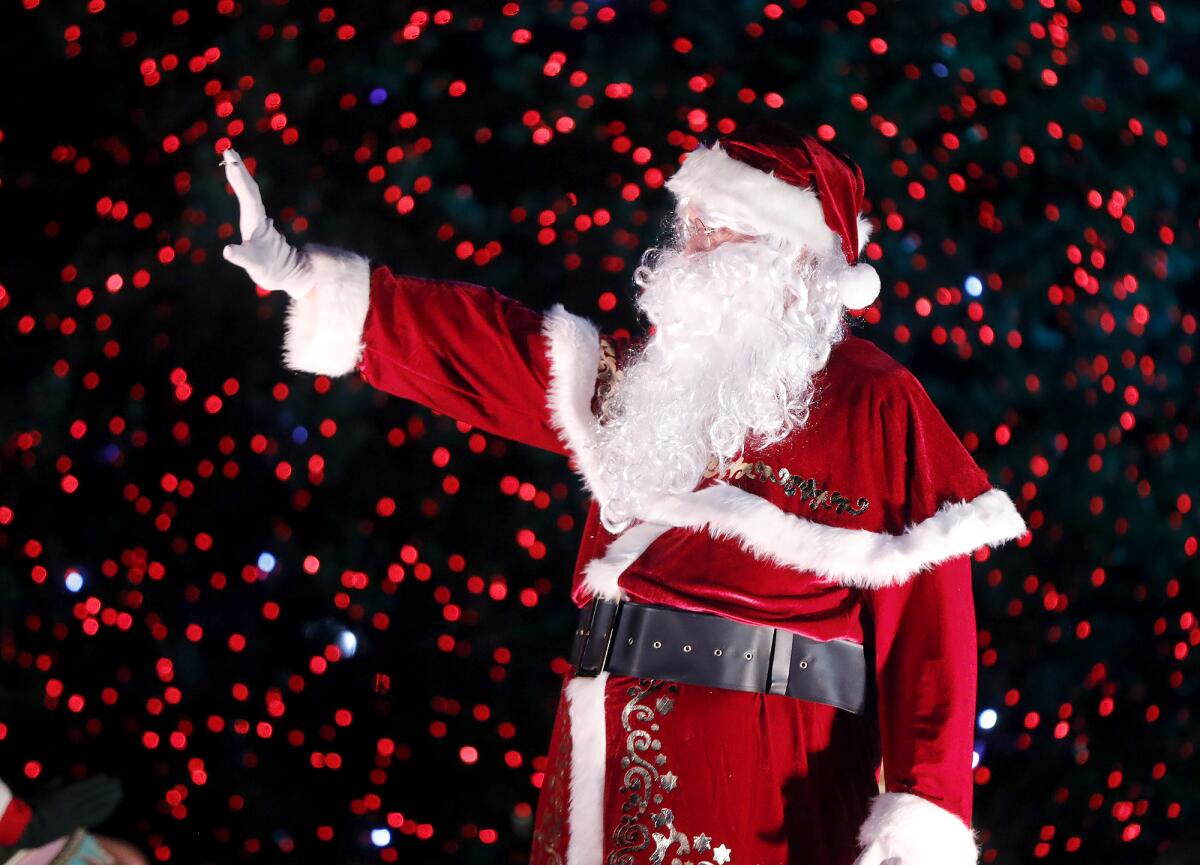 Santa C greets guests during a preview Tuesday for Night of Lights OC.