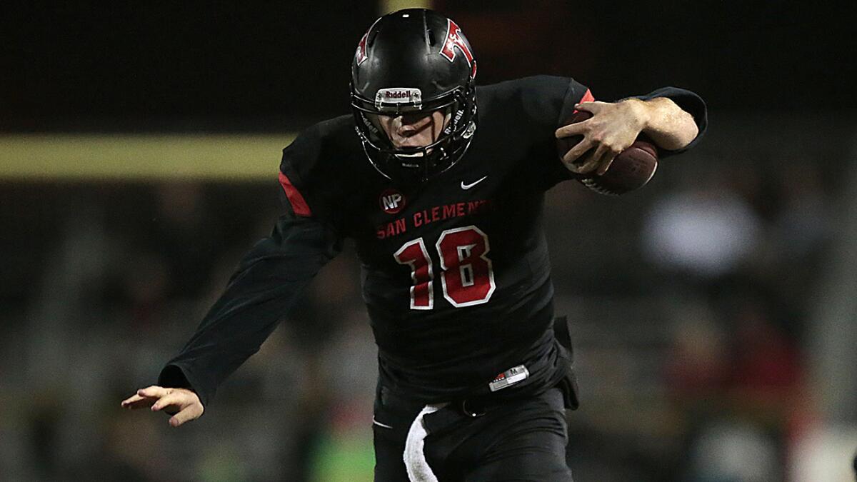 San Clemente quarterback Sam Darnold scrambles during a loss to Trabuco Hills in the CIF Southwest Division final on Dec. 5. Darnold has committed to USC.
