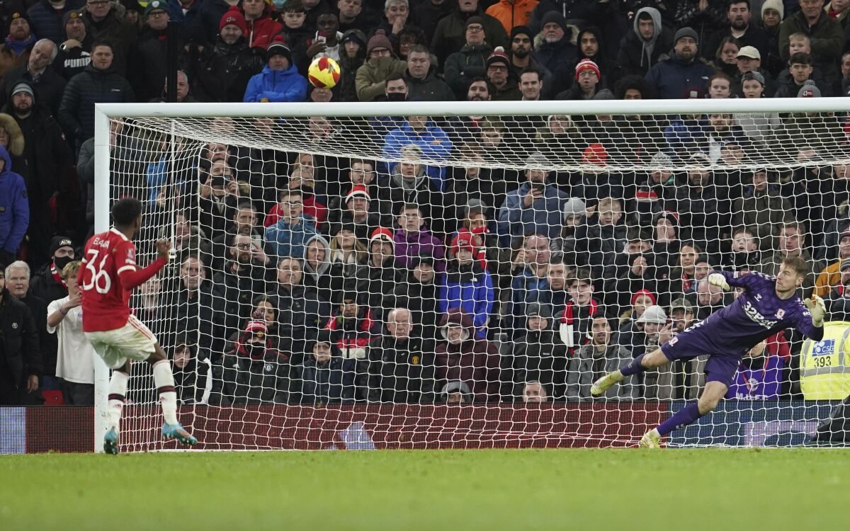 Manchester United's Anthony Elanga fails to score from the penalty spot during the English FA Cup fourth round soccer match between Manchester United and Middlesbrough at Old Trafford stadium in Manchester, England, Friday, Feb. 4, 2022. (AP Photo/Jon Super)