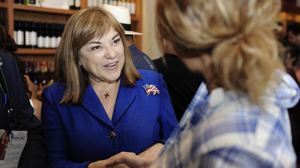 U.S. Senate candidate Loretta Sanchez talks with potential voters at San Antonio Winery in June.