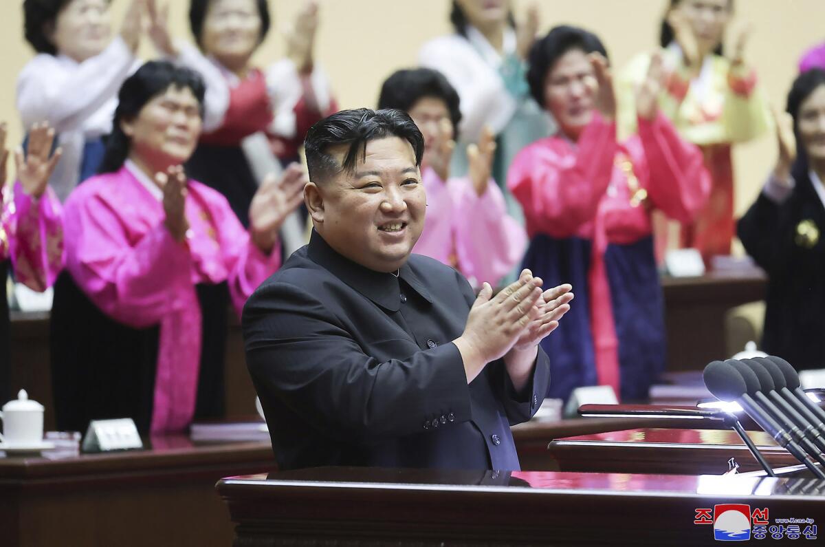 North Korean leader Kim Jong Un applauds.