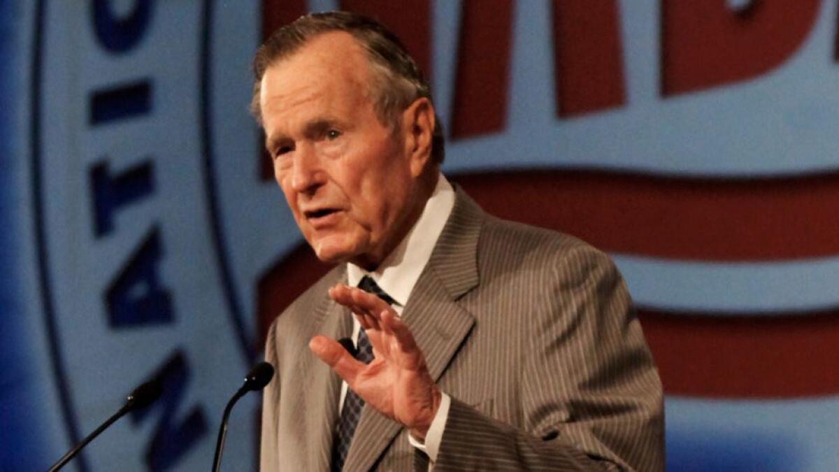 Former President George H.W. Bush speaks to the National Automobile Dealers Association during their meeting held in New Orleans Monday, Jan. 26, 2009. (AP Photo/ Judi Bottoni)