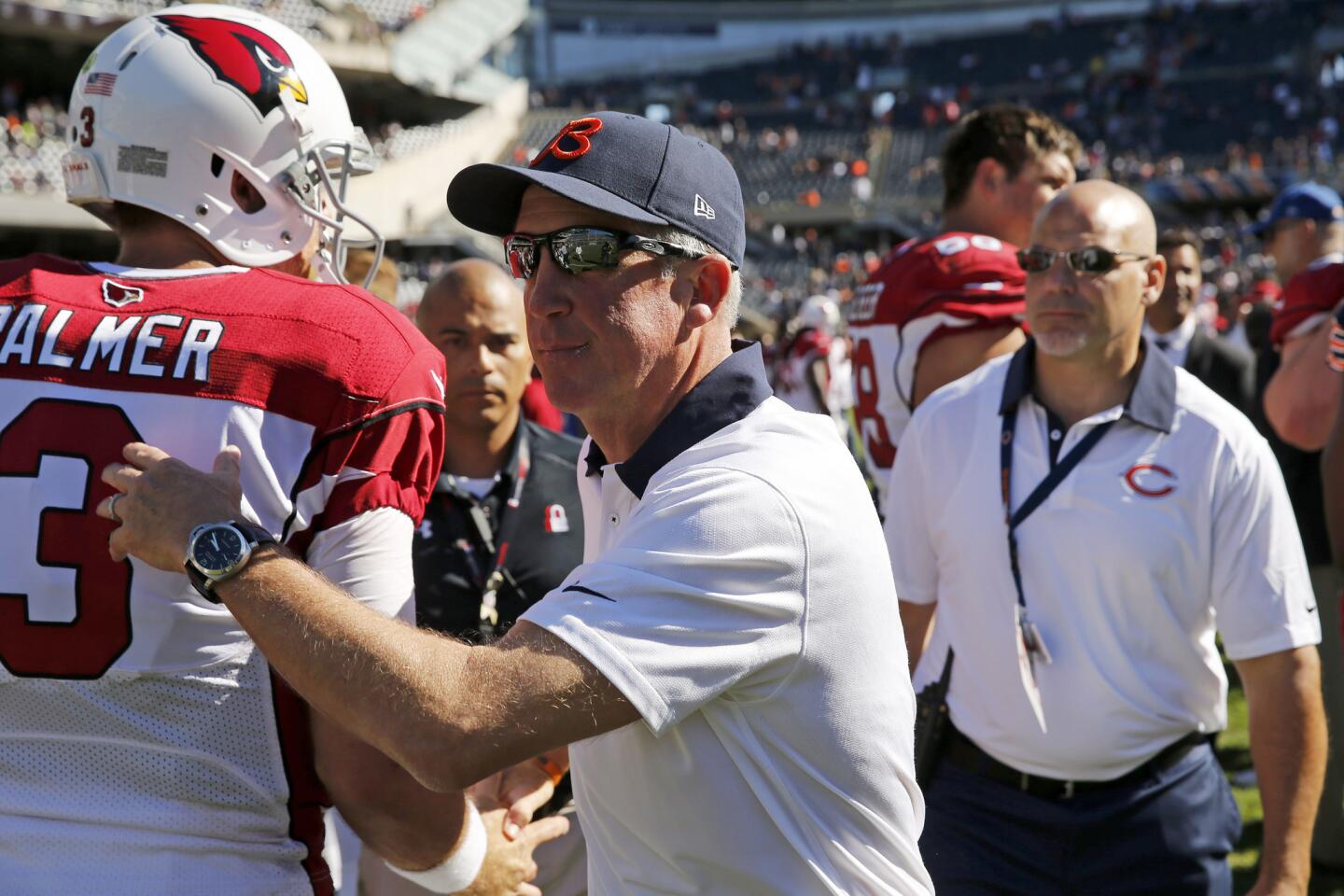 Bears coach John Fox congratulates Cardinals quarterback Carson Palmer following the game.
