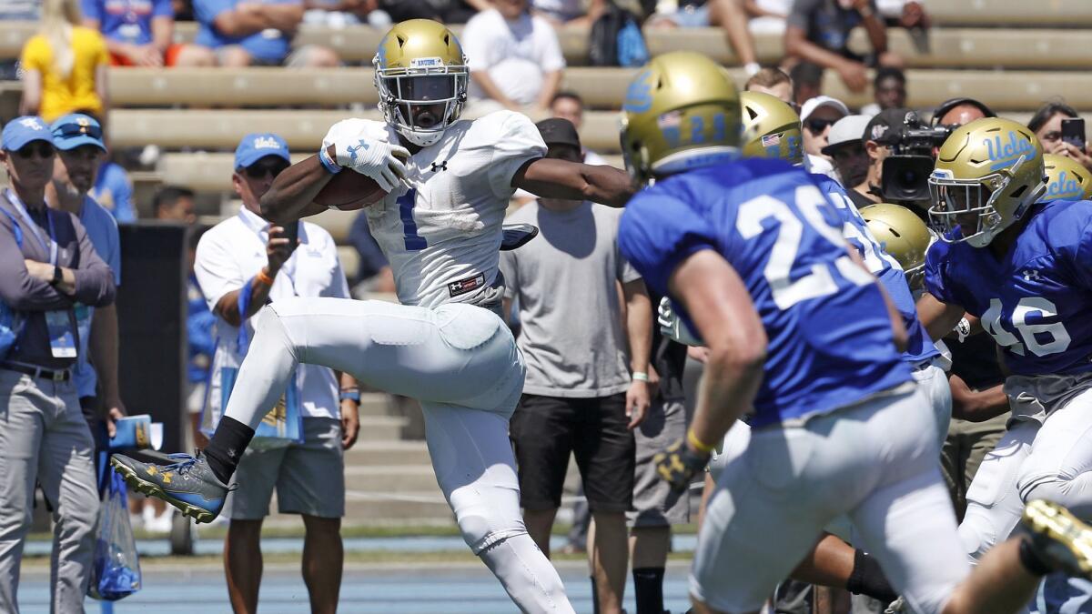 UCLA running back Soso Jamabo breaks free for a long gain during the Bruins' spring football game at Drake Stadium.