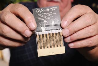 Pasadena, CA - October 15: Bob Donnelson holds an El Prado Motor Inn matchbook during an Angelus Matchcover club meetup where folks that collect matchbooks and covers can show, trade and talk about their collection at a home on Sunday, Oct. 15, 2023 in Pasadena, CA. The group meets once a month on Sunday. (Dania Maxwell / Los Angeles Times)